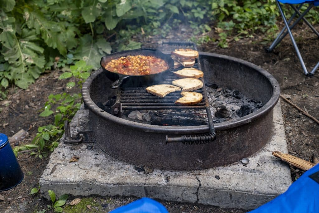 breakfast being cooked on the fire pit or grill